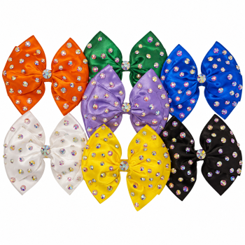 Five-inch satin hair bows with diamante in seven colours on a white background