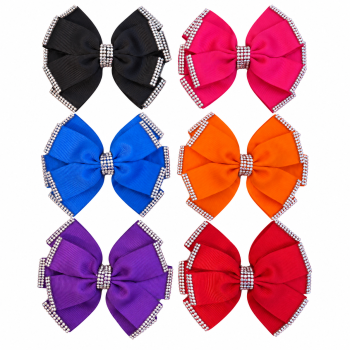 Diamante ribbon bows in black, pink, blue, orange, purple and red on a white background